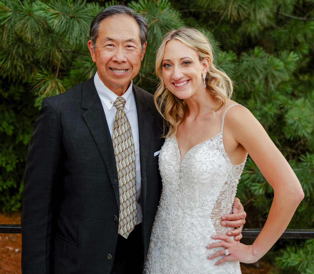 Adrianne (Kuhar) Ballarino and John Chan, MD, retired neonatologist at Adrianne's wedding. 